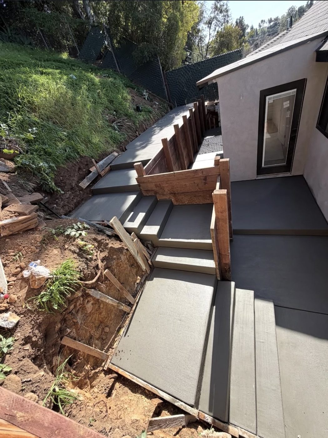 Freshly poured hillside steps and patio