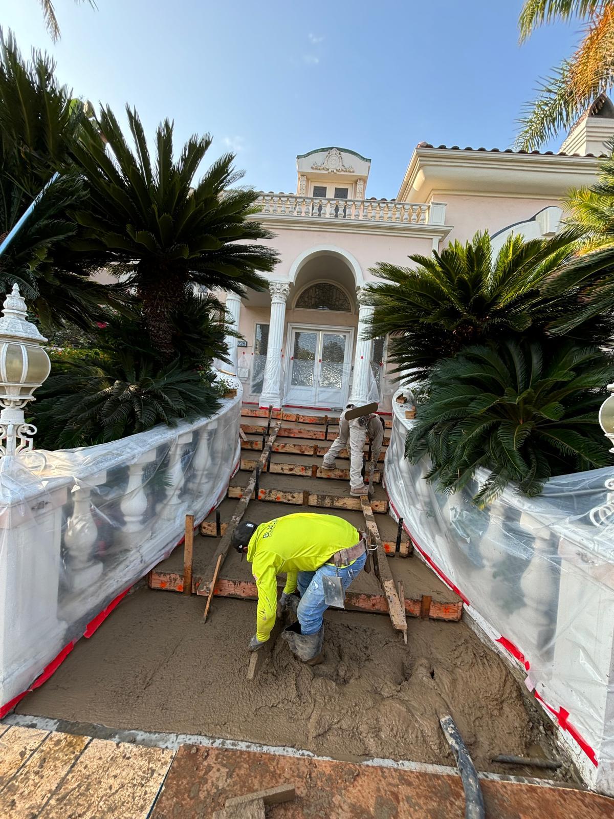 Alderete Concrete crew forming and pouring front entry steps